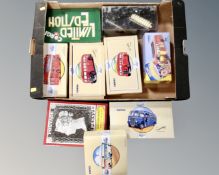 A box of Corgi Classic die cast vehicles, an AEC Regal coach, limited edition Corgi figures.
