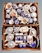 Two boxes of Ringtons blue and white Maling reproductions, caddies, willow pattern storage jars etc.