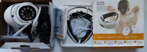 Boxed outdoor security camera, back massager, bbq/kitchen tools, and a typewriter.