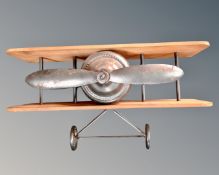 A contemporary wall shelf in the form of a biplane