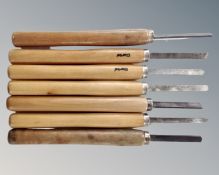 Seven wood turning chisels.