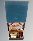 A box of carved wooden spoon rack with spoons, wooden bowl, picture frames,