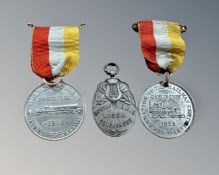 A silver medal marked North of England Musical Tournament and two Darlington Railway Centenary