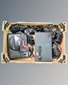 A Sony PlayStation 2 console together with a SEGA Mega Drive console with controllers and leads.