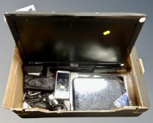 A box of electricals Technika 21 LCD TV/DVD with remote, binoculars,
