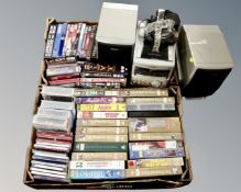 Two boxes of DVD's and VHS cassettes,