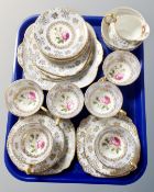 A tray containing a Wedgwood bone china hand finished rose spray tea service.