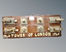 A mahogany panel mounted with brass door locks 'Vacant and Engaged'
