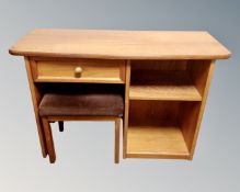 A G-Plan teak kneehole dressing table with stool