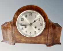 An early 20th century walnut mantel clock.