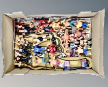 A box containing a quantity of 20th century wrestling figures, Hulk Rules, WWF figures etc.