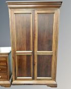 A Willis and Gambier cherry wood double door wardrobe