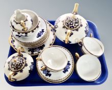 A tray of continental gilded and blue enamel tea china.