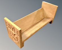 A carved light oak book trough.