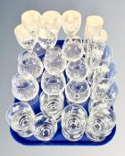 A tray containing etched glass, cut crystal wine glasses etc.