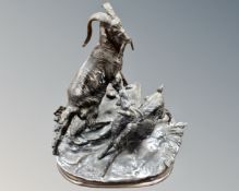 An early 20th century bronze figure of two goats on plinth.