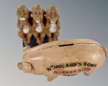 A cast iron Quaker City advertising money box together with a further 'Hear No Evil, Speak No Evil,