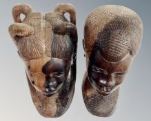 Two Balinese carved head figures together with two panels.