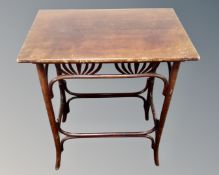 An Edwardian bentwood occasional table