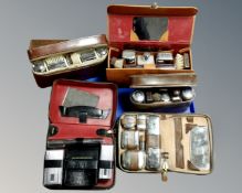 A tray of mid-20th century gent's travel sets, chrome plated examples etc.