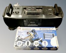 A retro Sharp portable hifi together with a Starcom universal helmet communication system.
