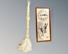 A bell-pull from HMS Ark Royal (R07), together with a teak-framed Ark Royal wall timepiece.