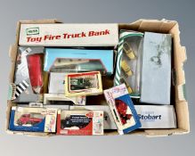 A box of die cast vehicles, toy firetruck bank, Days Gone die cast etc.