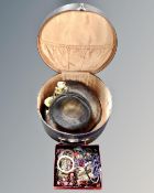 A vintage hat box containing lady's hat,