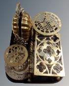 A tray of antique and later metal wares, silver plated embossed tray, brass trivets,