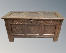 A George III carved oak panelled coffer.