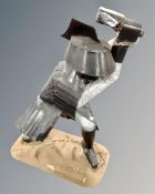 A folk art figure of a samurai.