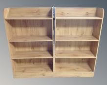 A pair of Alstons Furniture pine effect open bookshelves.