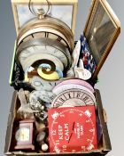 Two boxes containing a large quantity of assorted battery operated wall and mantel clocks.