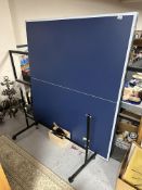 A table tennis table CONDITION REPORT: May be missing parts.