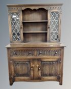 A 20th century oak linen fold Welsh dresser.