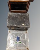 A vintage metal deed box together with a 19th century leaded glass window and an oak dressing table