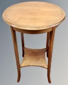 A mahogany circular occasional table with satinwood inlay.