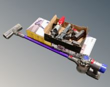 A Dyson V7 animal cordless vacuum cleaner with box, accessories,