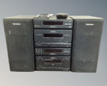 A Technics four piece micro hifi system with speakers,