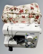 A Brother LS14 electric sewing machine with bag