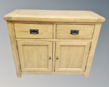 A Barker & Stonehouse contemporary oak double door sideboard fitted with two drawers above.