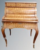 A reproduction marquetry Bonheur Du Jour writing desk with gilt metal mounts.