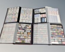 Four stamp albums containing a good collection of 20th century world stamps