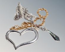 A large floating silver heart on silver chain,