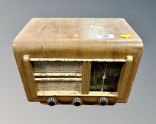 A 1930s walnut cased valve radio.