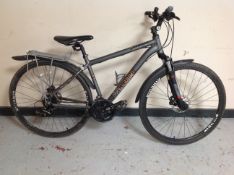 A Voodoo Marasa front suspension mountain bike with rear pannier.
