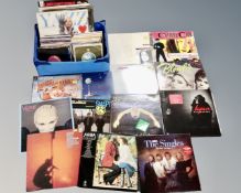 A box of vinyl records to include 12