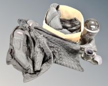 A box of motorcycle leathers, jacket, helmet,