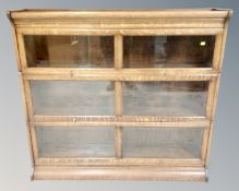 An Edwardian oak three tier sectional bookcase,