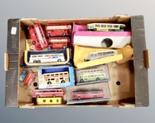 A box containing boxed and unboxed die cast busses.